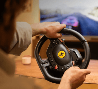 Person racing with the Thrustmaster Ferrari racing wheel