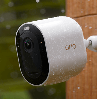 Arlo camera mounted on the side of a house