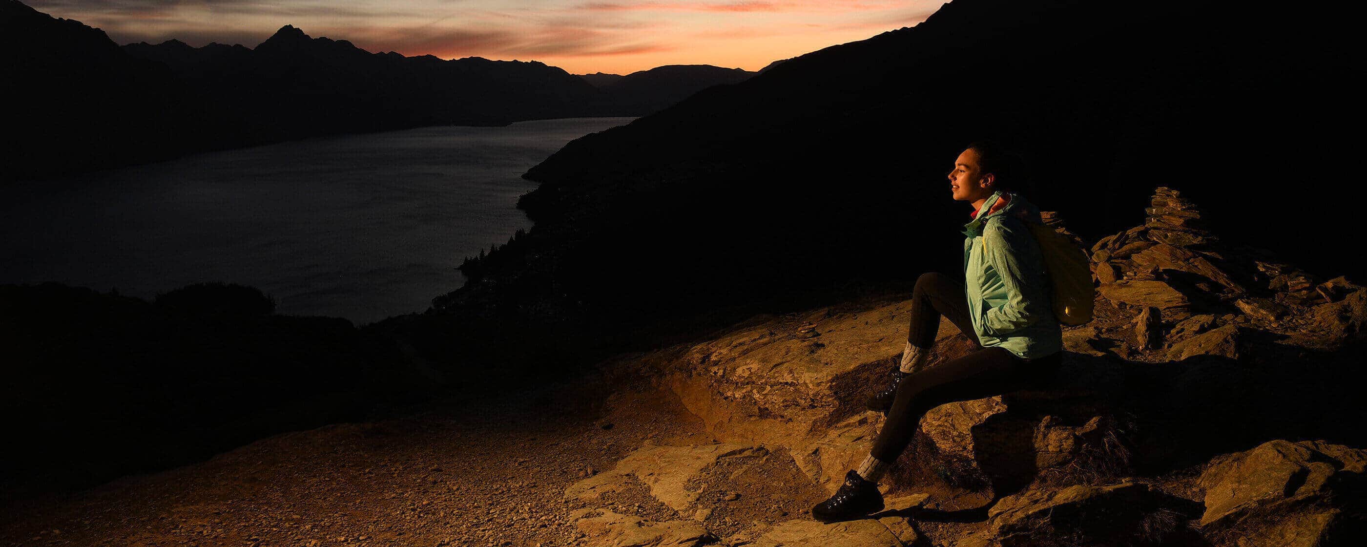 Nikon WOman Sitting on Rock