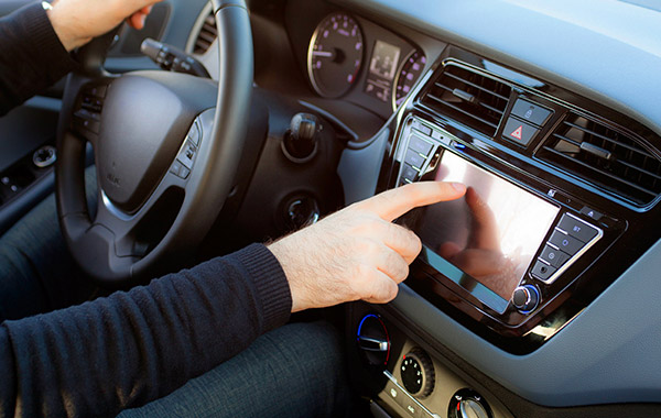 ADATA person in car touching radio