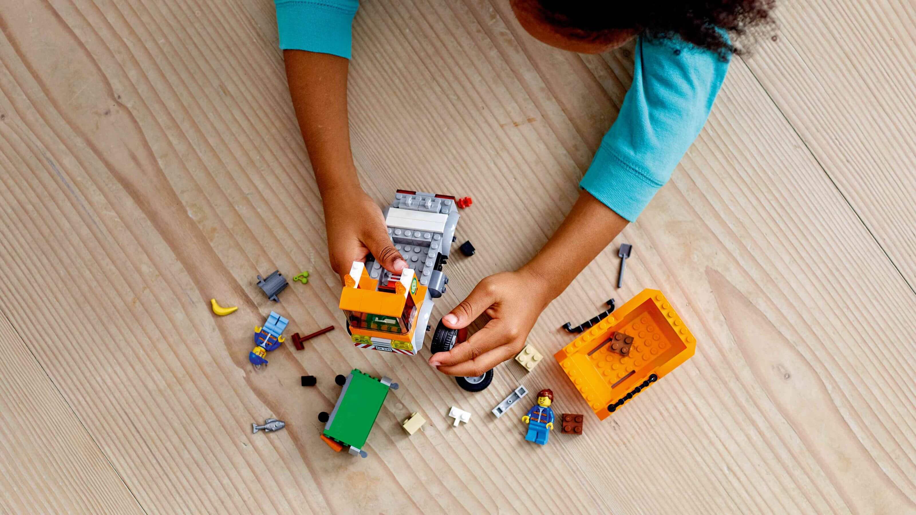 Kid playing with Legos on Floor