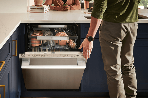 LG Studio Man Opening up Dishwasher