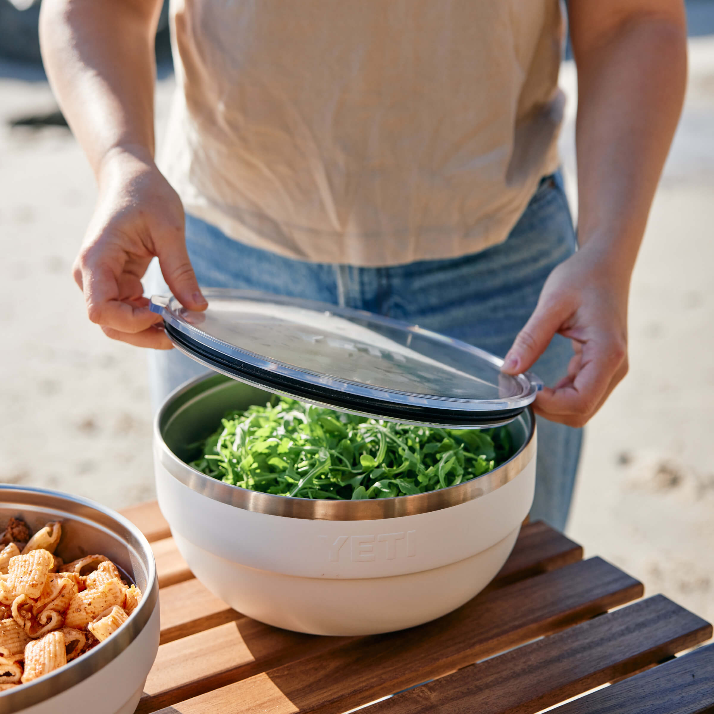 Woman Closing storing food in yeti kitchenware